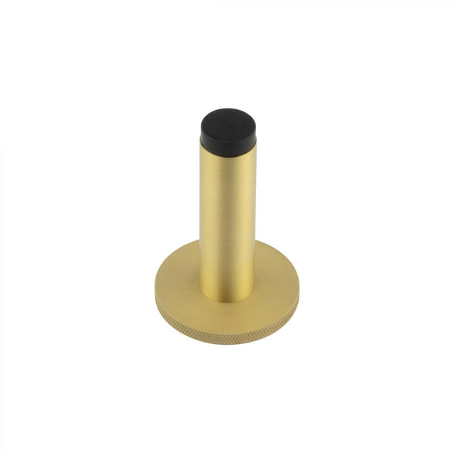 This is an image showing the Frelan - Burlington Plain Wall Mounted Door Stops Knurled Rose Satin Brass available to order from T.H. Wiggans Ironmongery in Kendal