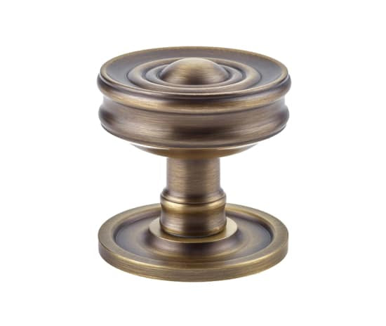 This is an image showing the Burlington - Bloomury Mortice knob - Antique Brass available to order from T.H. Wiggans Ironmongery in Kendal