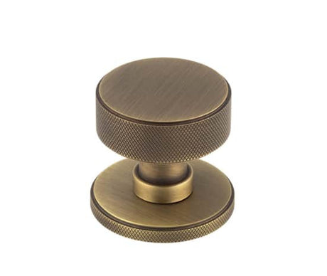 This is an image showing the Burlington - Antique Brass Westbourne Knurled Mortice Door Knob available to order from T.H. Wiggans Ironmongery in Kendal