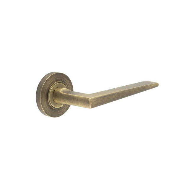 This is an image showing the Frelan - Mayfair Door Handle on Plain Rose Antique Brass available to order from T.H. Wiggans Ironmongery in Kendal