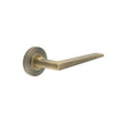 This is an image showing the Frelan - Mayfair Door Handle on Chamfered Rose Antique Brass available to order from T.H. Wiggans Ironmongery in Kendal