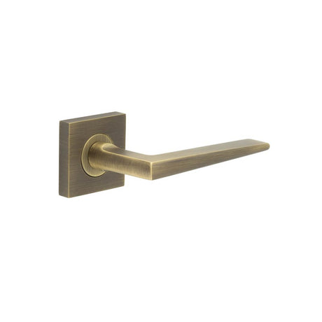 This is an image showing the Frelan - Mayfair Door Handle on Square Plain Rose Antique Brass available to order from T.H. Wiggans Ironmongery in Kendal