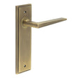 This is an image showing the Frelan - Mayfair Door Handle Latch Backplate Antique Brass available to order from T.H. Wiggans Ironmongery in Kendal