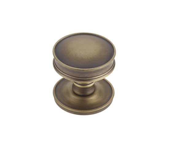 This is an image showing the Burlington - Berkeley cupboard knob - Antique Brass available to order from T.H. Wiggans Ironmongery in Kendal