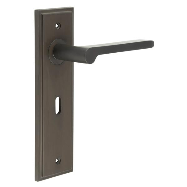 This is an image showing the Frelan - Fitzrovia Door Handle Lock Backplate Dark Bronze available to order from T.H. Wiggans Ironmongery in Kendal