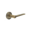 This is an image showing the Frelan - Knightsbridge Door Handle on Chamfered Rose Antique Brass available to order from T.H. Wiggans Ironmongery in Kendal