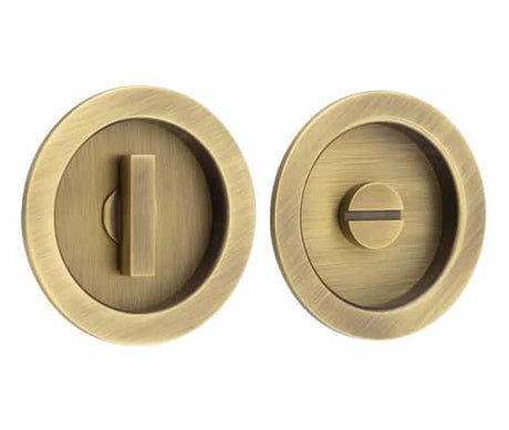 This is an image showing the Burlington - 65x12x3mm AB round concealed WC flush pull set available to order from T.H. Wiggans Ironmongery in Kendal