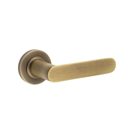 This is an image showing the Frelan - Kensington Door Handles Plain Rose Antique Brass available to order from T.H. Wiggans Ironmongery in Kendal