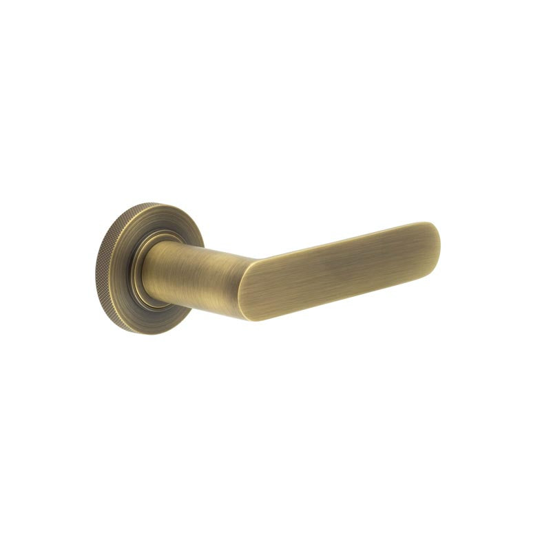 This is an image showing the Frelan - Kensington Door Handles Knurled Rose Antique Brass available to order from T.H. Wiggans Ironmongery in Kendal