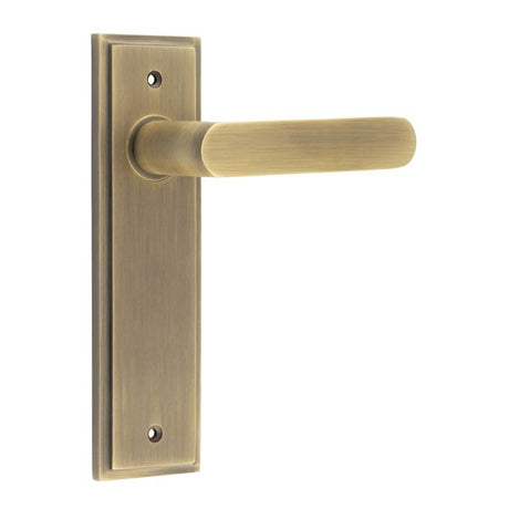 This is an image showing the Frelan - Kensington Door Handle Latch Backplate Antique Brass available to order from T.H. Wiggans Ironmongery in Kendal