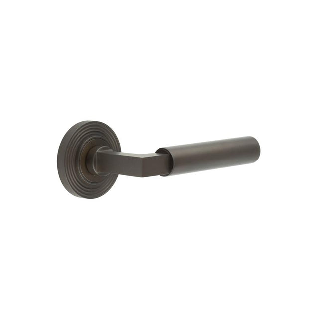 This is an image showing the Frelan - Westminster Door Handle on Reeded Rose Dark Bronze available to order from T.H. Wiggans Ironmongery in Kendal