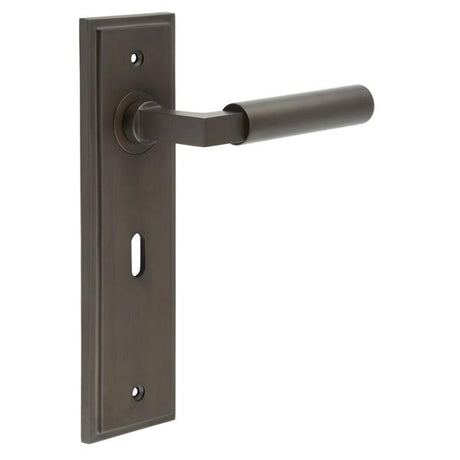 This is an image showing the Frelan - Westminster Door Handle Lock Backplate Dark Bronze available to order from T.H. Wiggans Ironmongery in Kendal