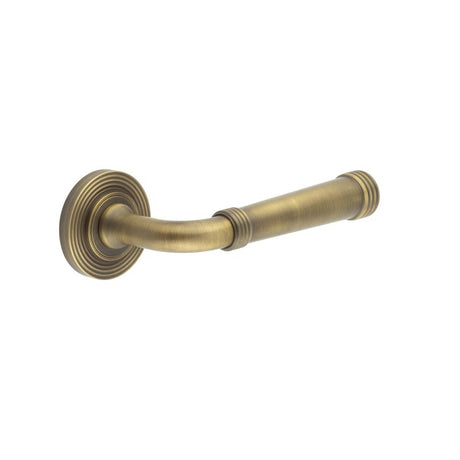 This is an image showing the Frelan - Highgate Door Handles Reeded Rose Antique Brass available to order from T.H. Wiggans Ironmongery in Kendal