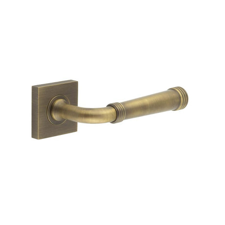 This is an image showing the Frelan - Highgate Door Handles Square Plain Rose Antique Brass available to order from T.H. Wiggans Ironmongery in Kendal