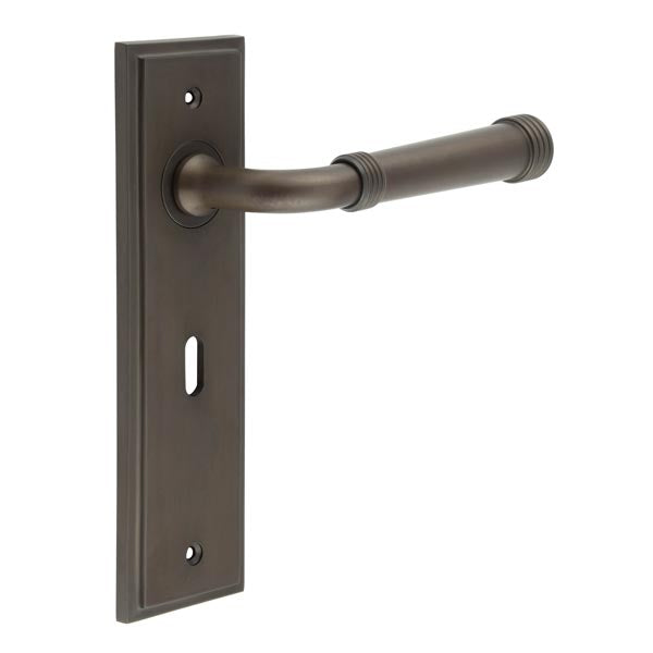 This is an image showing the Frelan - Highgate Door Handle Lock Backplate Dark Bronze available to order from T.H. Wiggans Ironmongery in Kendal