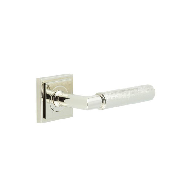 This is an image showing the Frelan - Piccadilly Door Handle on Square Stepped Rose Polished Nickel available to order from T.H. Wiggans Ironmongery in Kendal