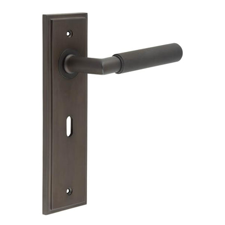 This is an image showing the Frelan - Piccadilly Door Handle Lock Backplate Dark Bronze available to order from T.H. Wiggans Ironmongery in Kendal