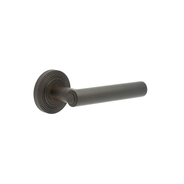 This is an image showing the Frelan - Richmond Door Handles Reeded Rose Dark Bronze available to order from T.H. Wiggans Ironmongery in Kendal