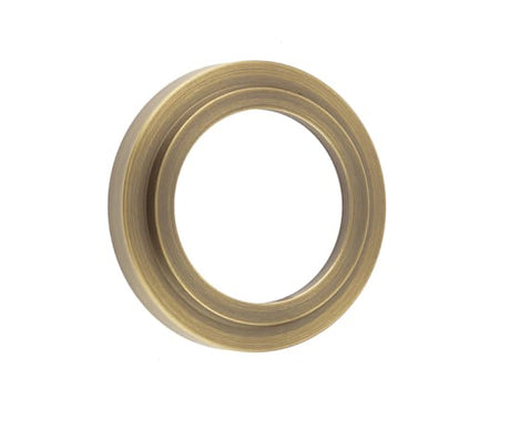 This is an image showing the Burlington - Stepped outer rose for ESC - Antique Brass available to order from T.H. Wiggans Ironmongery in Kendal