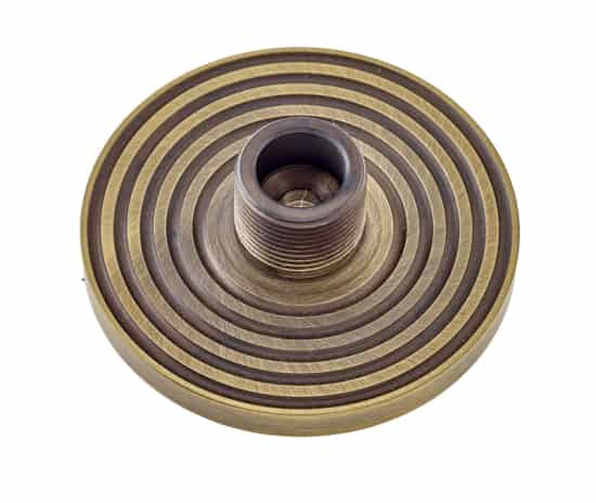 This is an image showing the Burlington - Reeded door stop base - Antique Brass available to order from T.H. Wiggans Ironmongery in Kendal