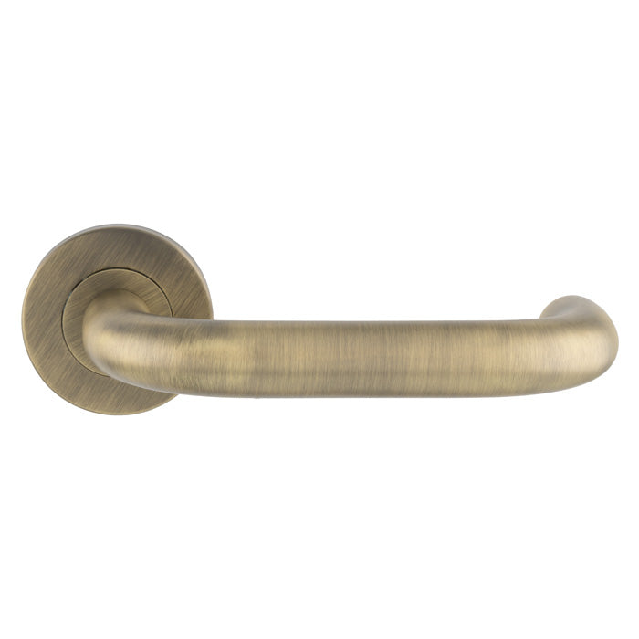 This is an image of Eurospec - Nera Safety Lever on Sprung Rose - Antique Brass - CSL1190AB available to order from T.H. Wiggans Ironmongery in Kendal.