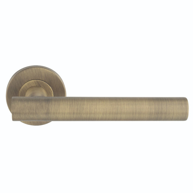 This is an image of Eurospec - Philadelphia Lever on Sprung Rose - Antique Brass- CSL1194AB available to order from T.H. Wiggans Ironmongery in Kendal.