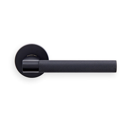 This image shows Manital - hey rete lever handle on threaded round rose ner (matt black) - matt black - hn5mb available from T.H. Wiggans Ironmongery in Kendal.