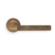 This image shows Manital - hey rete lever handle on threaded round rose bgo (antique brass) - antique brass - hn5ab available from T.H. Wiggans Ironmongery in Kendal.