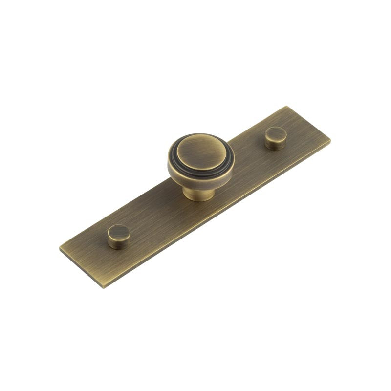 This is an image showing the Frelan - Cropley Cupboard Knobs 30mm Plain Backplate Antique Brass available to order from T.H. Wiggans Ironmongery in Kendal