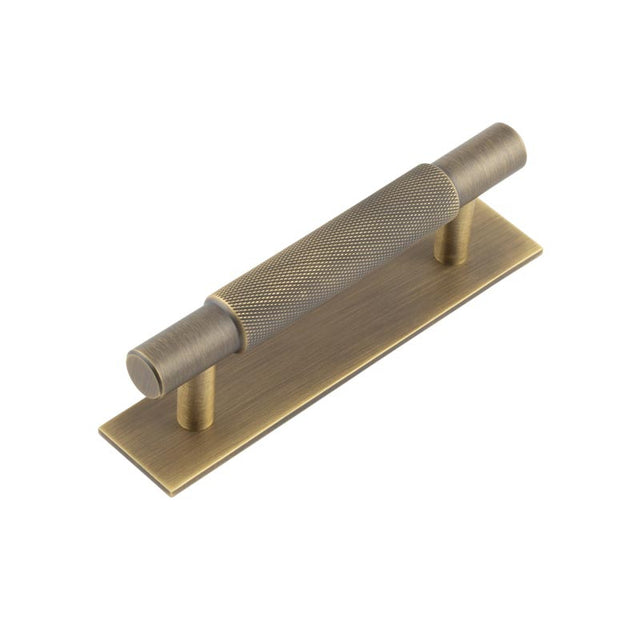 This is an image showing the Frelan - Hoxton Taplow Cabinet Handles 96mm Ctrs Plain Backplate Antique Brass available to order from T.H. Wiggans Ironmongery in Kendal