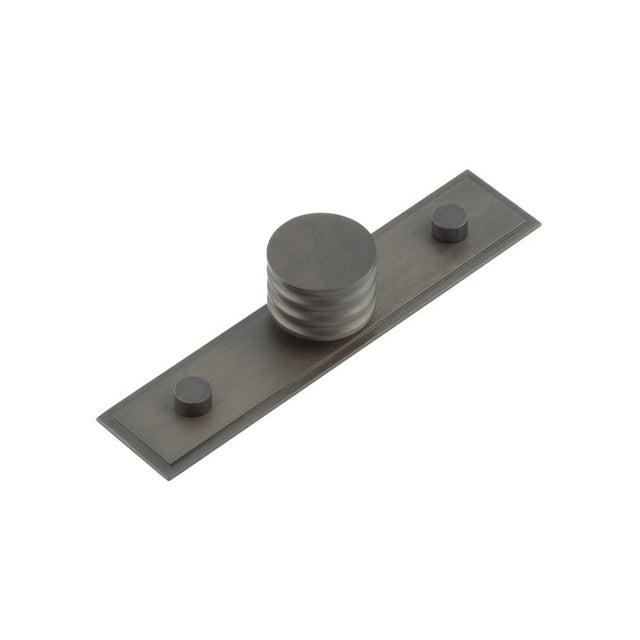 This is an image showing the Frelan - Sturt Cupboard Knobs 30mm Stepped Dark Bronze available to order from T.H. Wiggans Ironmongery in Kendal