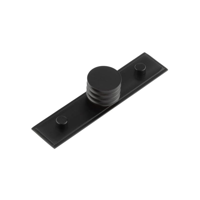 This is an image showing the Frelan - Sturt Cupboard Knobs 30mm Stepped Matt Black available to order from T.H. Wiggans Ironmongery in Kendal