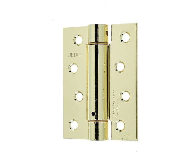 This is an image showing the Frelan - 102x76mm Steel Single Action Spring Hinges - Electro Brass available to order from T.H. Wiggans Ironmongery in Kendal