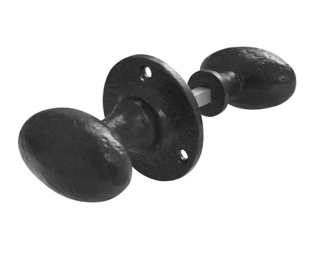 This is an image showing the Frelan - Oval Shape Rim Knobs - Antique Black available to order from T.H. Wiggans Ironmongery in Kendal