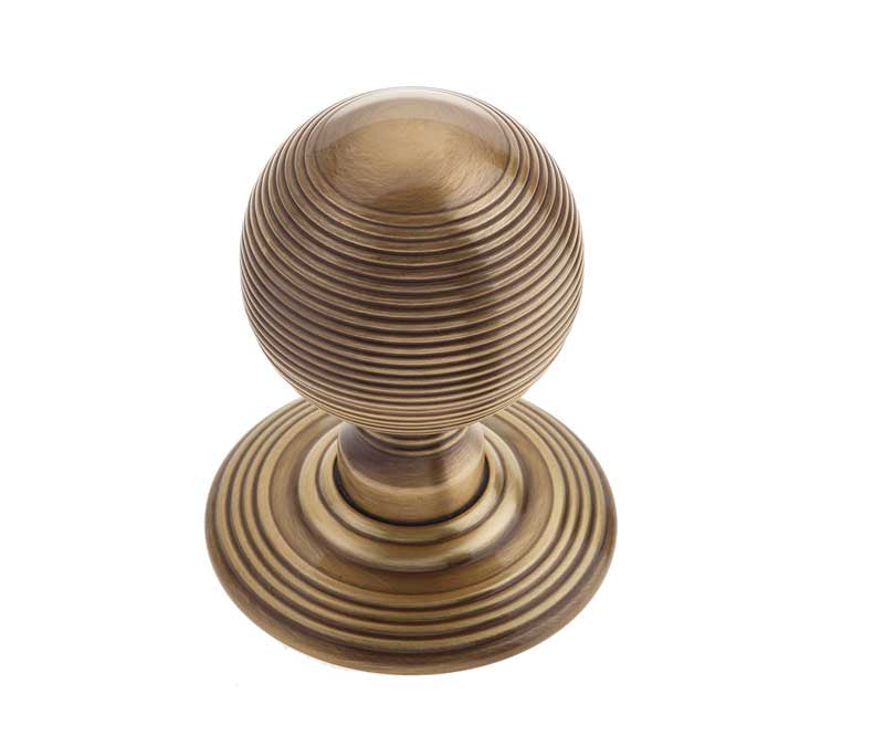 This is an image showing the Frelan - Reeded Unsprung Mortice Knobs - Antique Brass available to order from T.H. Wiggans Ironmongery in Kendal