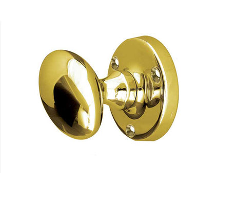 This is an image showing the Frelan - Kontrax Oval Mortice Knobs - Polished Brass available to order from T.H. Wiggans Ironmongery in Kendal