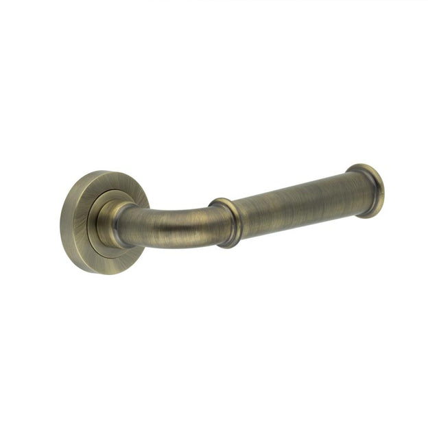 This is an image showing the Frelan - Classic Antique Brass Lever on rose available to order from T.H. Wiggans Ironmongery in Kendal