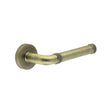 This is an image showing the Frelan - Midtown Antique Brass lever on rose available to order from T.H. Wiggans Ironmongery in Kendal