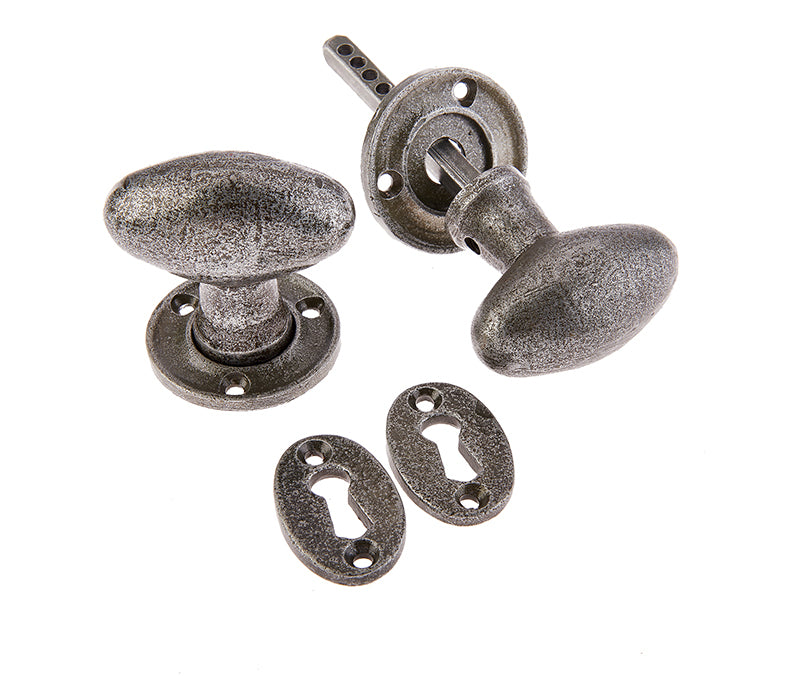 This is an image showing the Frelan - Valley Forge Oval Mortice Knobs - Pewter available to order from T.H. Wiggans Ironmongery in Kendal