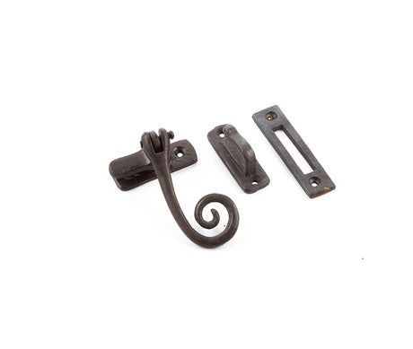 This is an image showing the Frelan - Valley Forge Curly Tail Casement Fastener - Beeswax available to order from T.H. Wiggans Ironmongery in Kendal