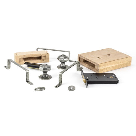 This is an image showing From The Anvil - Pewter Oak Box Lock & Octagonal Knob Set available from T.H Wiggans Architectural Ironmongery in Kendal, quick delivery and discounted prices