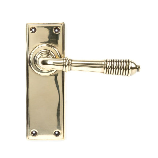 This is an image of From The Anvil - Aged Brass Reeded Lever Latch Set available to order from T.H Wiggans Architectural Ironmongery in Kendal, quick delivery and discounted prices.