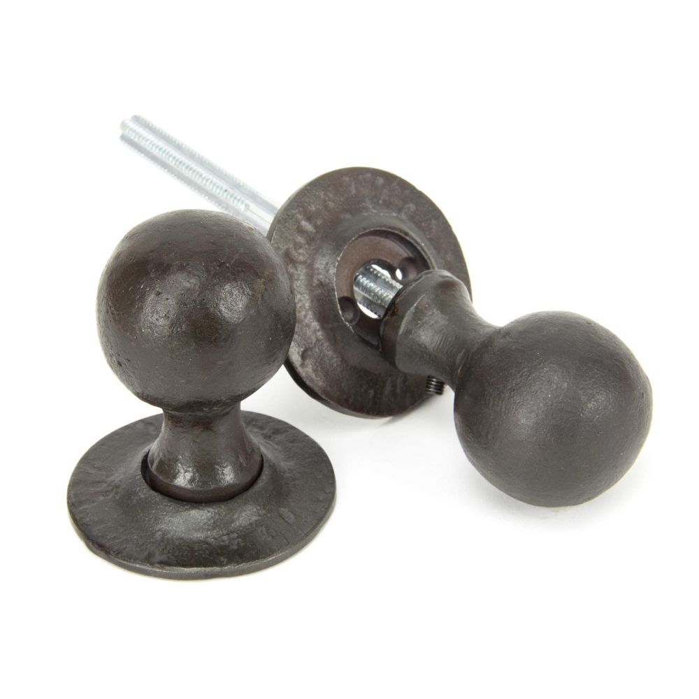 This is an image showing From The Anvil - Beeswax Round Mortice/Rim Knob Set available from trade door handles, quick delivery and discounted prices