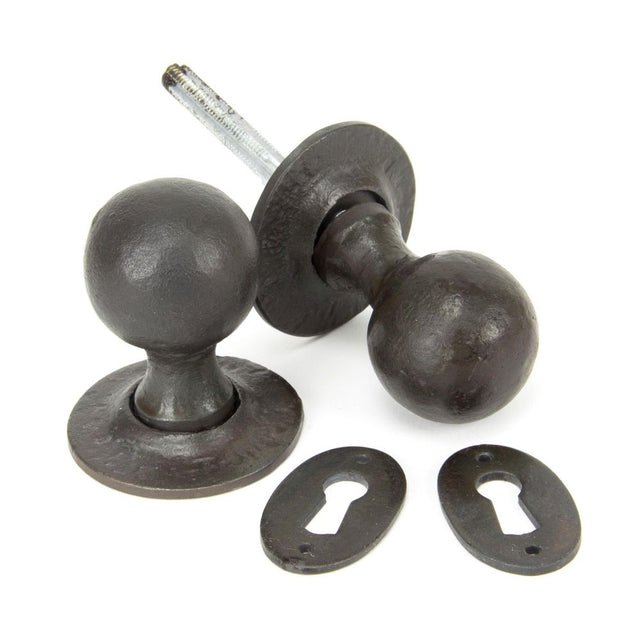 This is an image of From The Anvil - Beeswax Round Mortice/Rim Knob Set available to order from T.H Wiggans Architectural Ironmongery in Kendal, quick delivery and discounted prices.