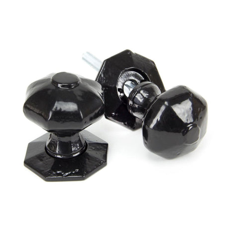 This is an image showing From The Anvil - Black Octagonal Mortice/Rim Knob Set available from trade door handles, quick delivery and discounted prices