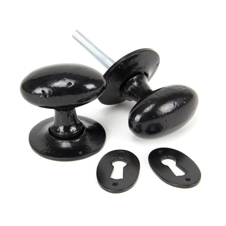 This is an image of From The Anvil - Black Oval Mortice/Rim Knob Set available to order from T.H Wiggans Architectural Ironmongery in Kendal, quick delivery and discounted prices.