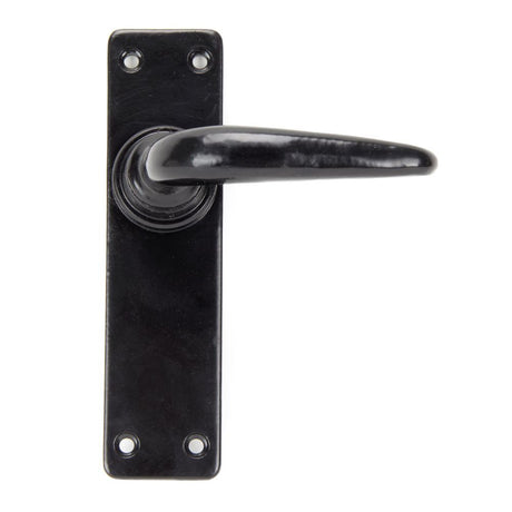 This is an image showing From The Anvil - Black Smooth Lever Latch Set available from trade door handles, quick delivery and discounted prices