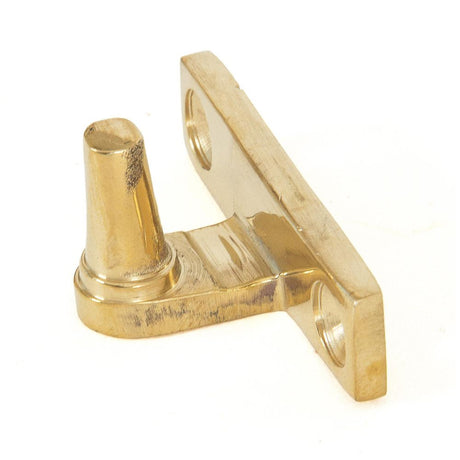 This is an image showing From The Anvil - Polished Brass Cranked Stay Pin available from T.H Wiggans Architectural Ironmongery in Kendal, quick delivery and discounted prices