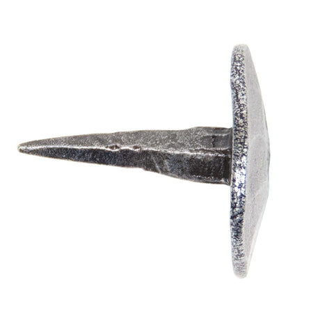 This is an image showing From The Anvil - Pewter 1" Handmade Nail (20mm HD DIA) available from T.H Wiggans Architectural Ironmongery in Kendal, quick delivery and discounted prices