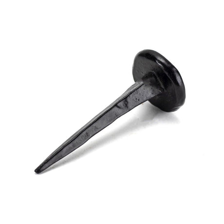 This is an image showing From The Anvil - Black 2" Handmade Nail available from trade door handles, quick delivery and discounted prices